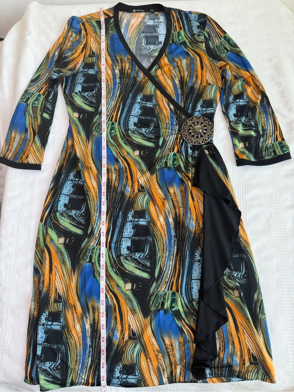 Milano Dress Size Medium with a brooch